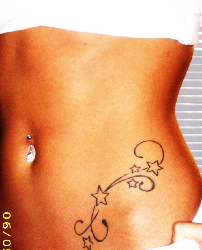 Tattoo in the Bikini zone at the girl
