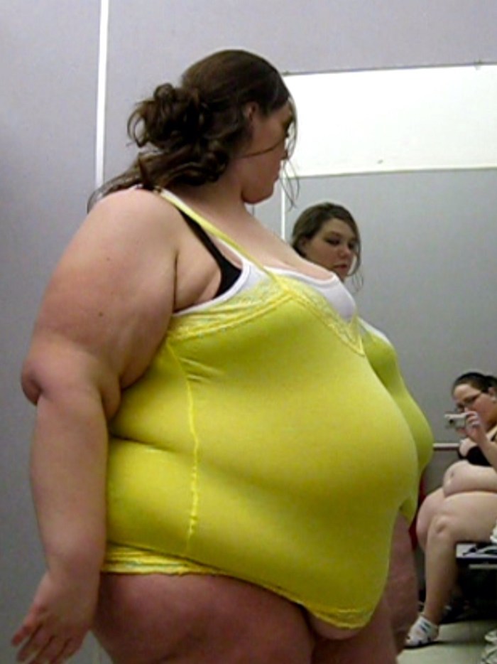 BBW Belly in a tight -fitting dress