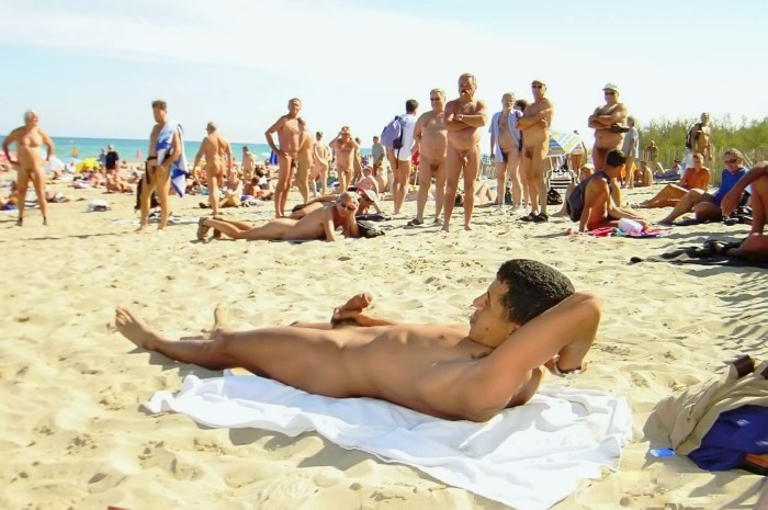 Adult man naked on the beach