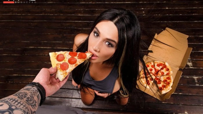 The girl eats pizza