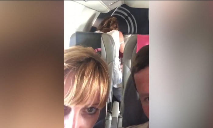 The girl showed boobs on an airplane