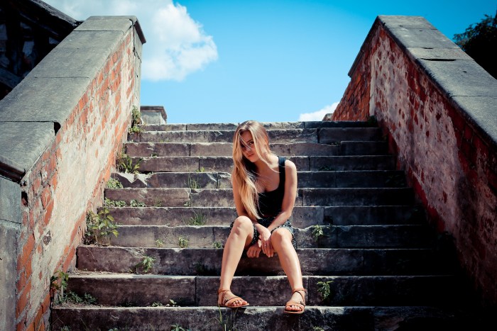 Girl sits on the stairs