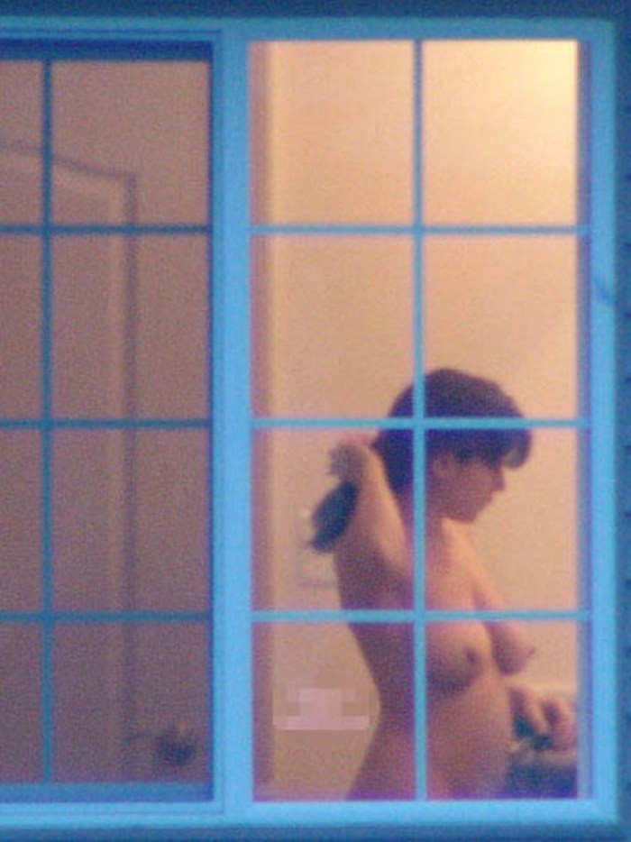 Naked women in the windows of houses