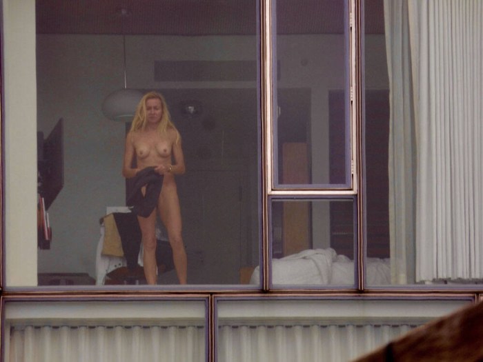 Naked exhibitionist in the window