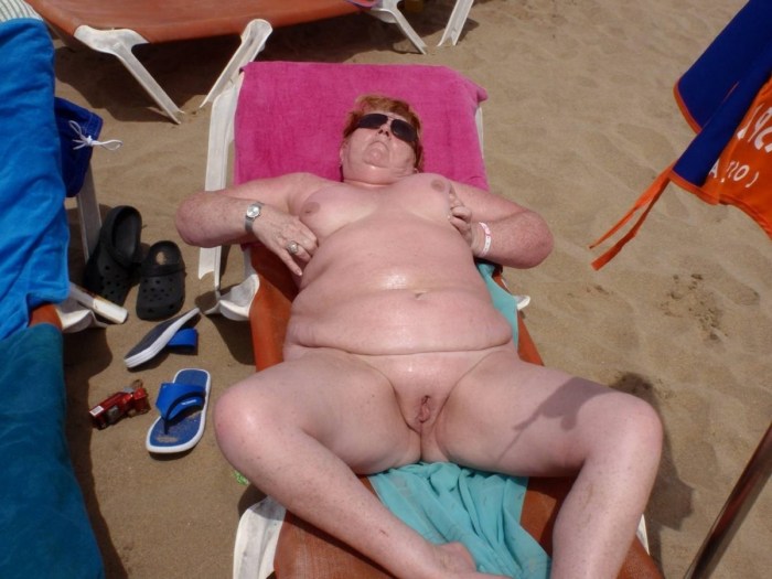 Wife with a crustacean on the beach Private