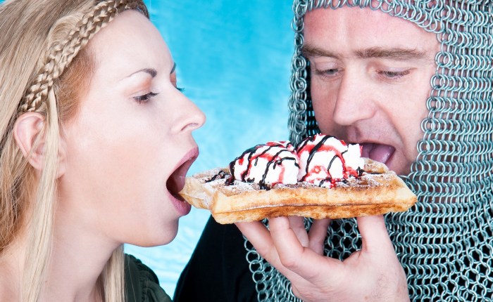 The girl eats waffles
