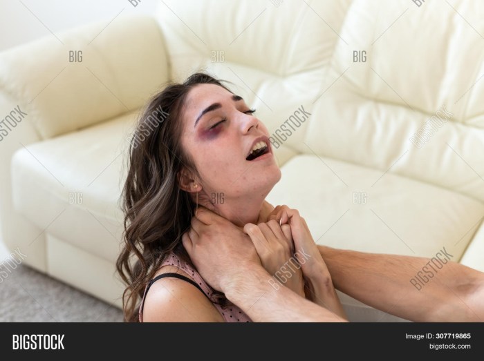 Woman strangles a man photo
