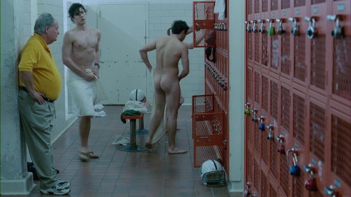 A naked man dresses up