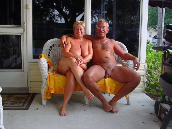 Naked Young Woman with Mature Men on Beach