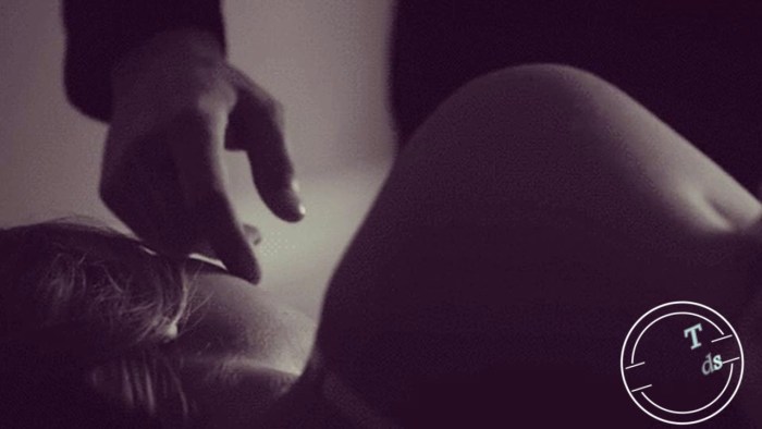 The guy strokes the girl on the back