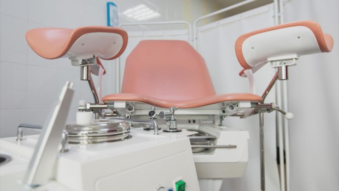 Woman gynecologist in gloves