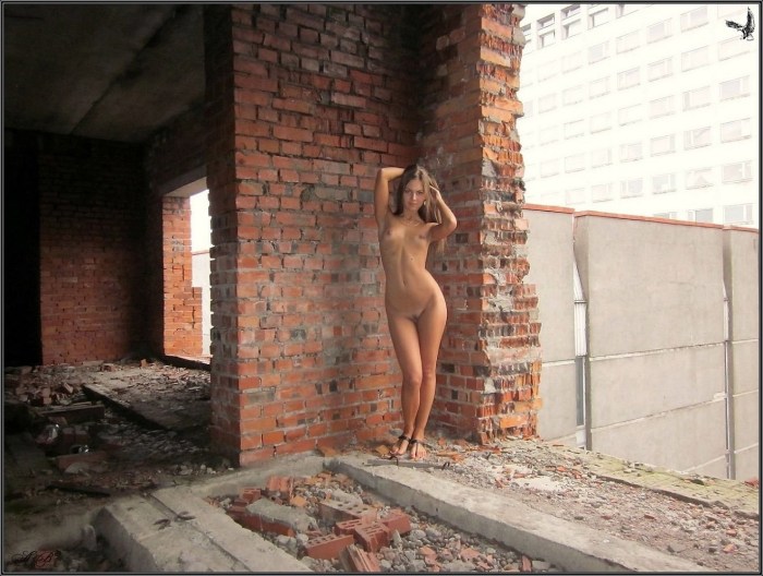 Naked in an abandoned building
