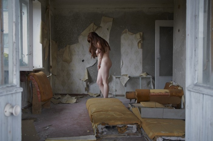 Naked schoolgirl in an abandoned building