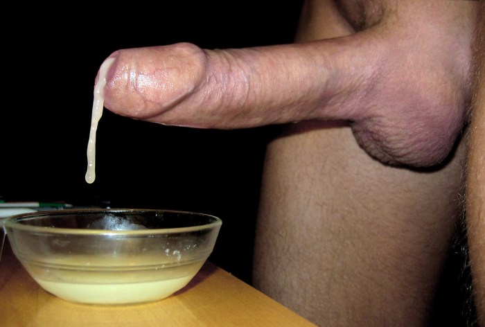 The man cums in a glass