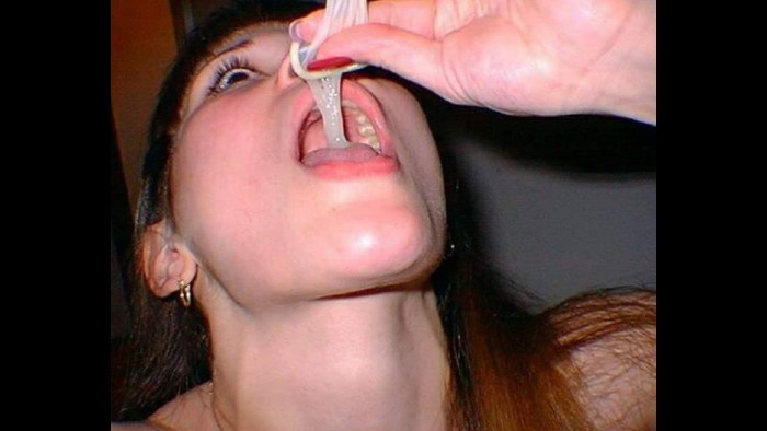 The girl drinks from the condom