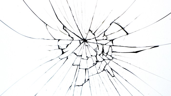 Broken glass from a window on a white background
