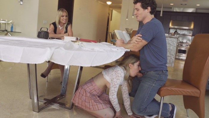 The girl spread her legs under the table