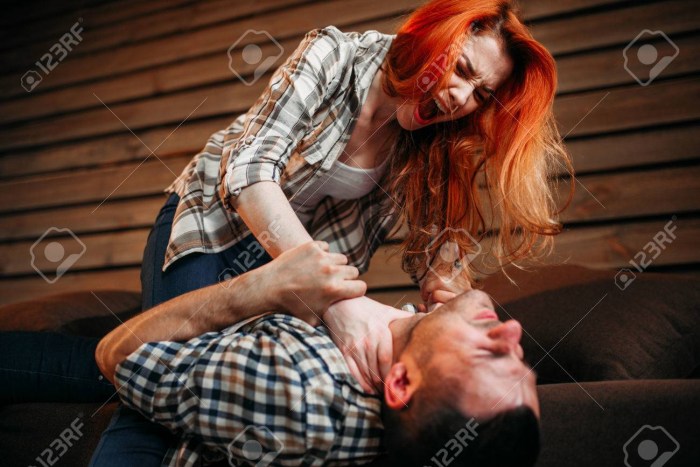 Woman strangles a man photo