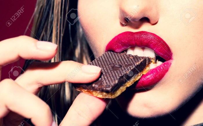Beautiful picture mouth bites chocolate