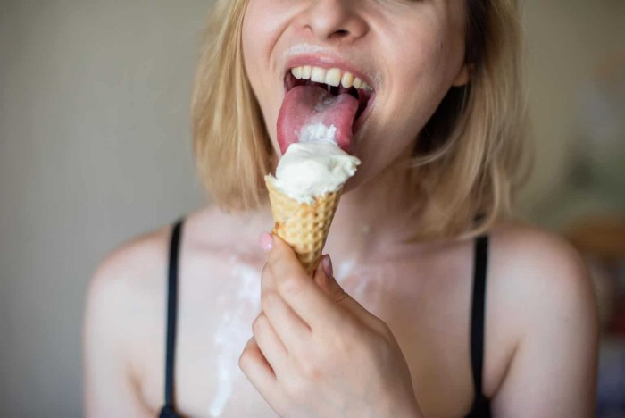 The blonde licks ice cream