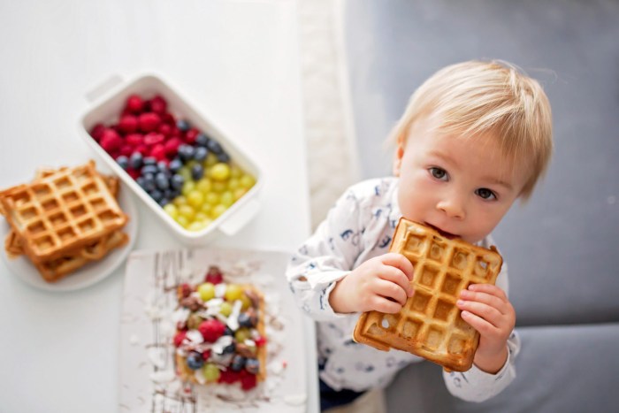 Children eat waffles