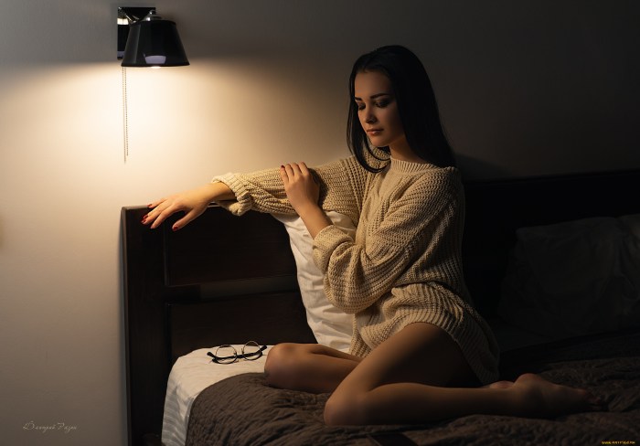 Girl in a sweater sits