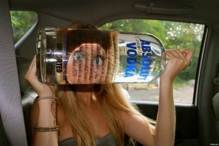 Girl with a bottle of vodka