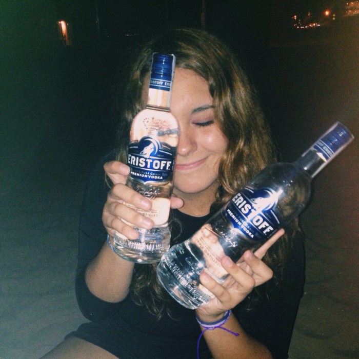 Girl with a bottle of vodka