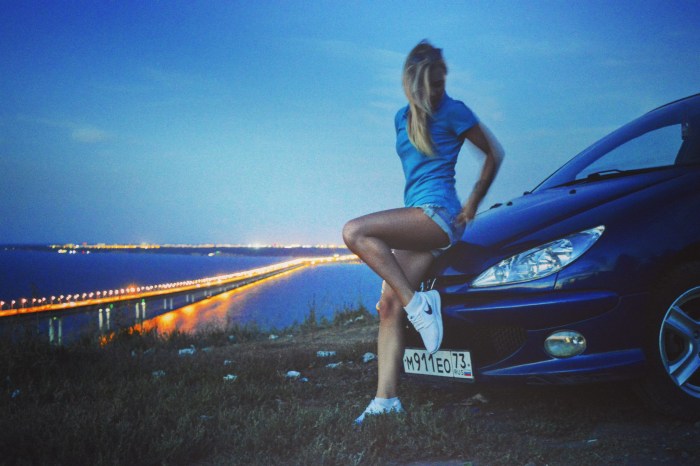 Girl near the car from the back