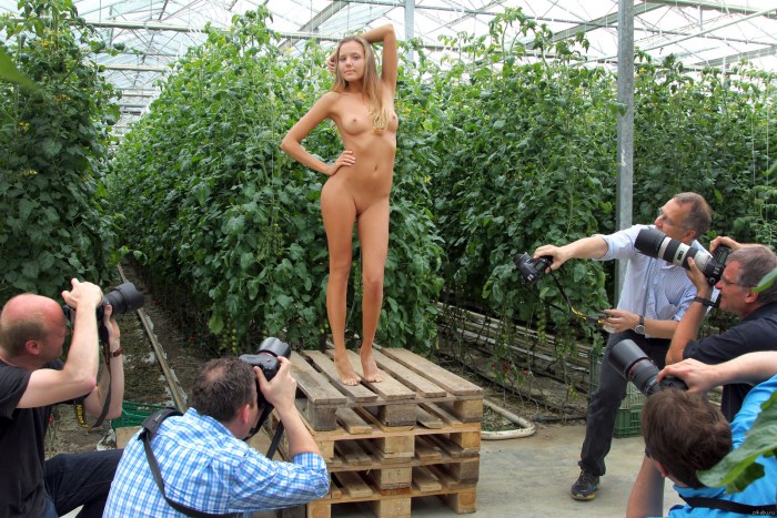Naked women behind the fence