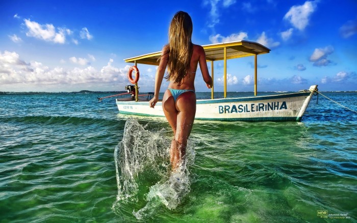 Board in a boat in a swimsuit