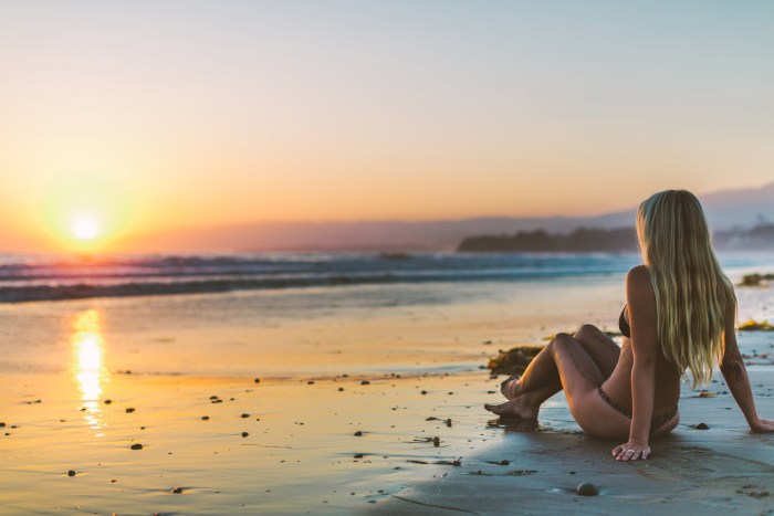 Girl at sunset by the sea