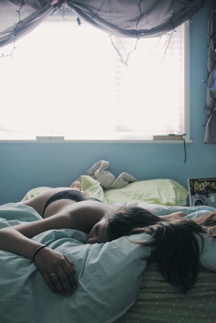 Girl sleeps in bed