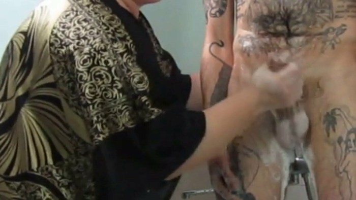 Girl washes a member of a guy