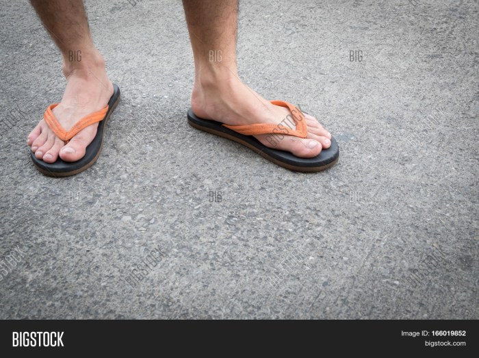 Builder's legs in sandals