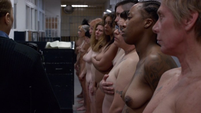 Naked women behind bars