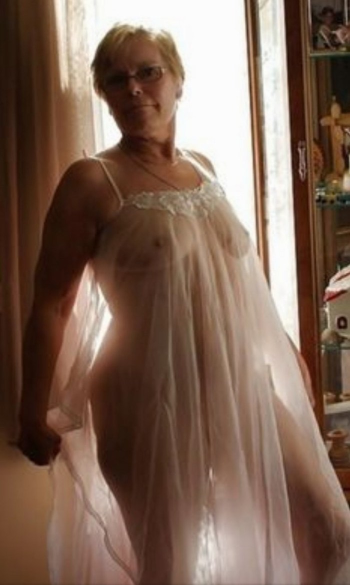 Naked woman in a silk dress