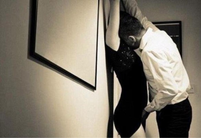 The guy pressed the girl against the wall