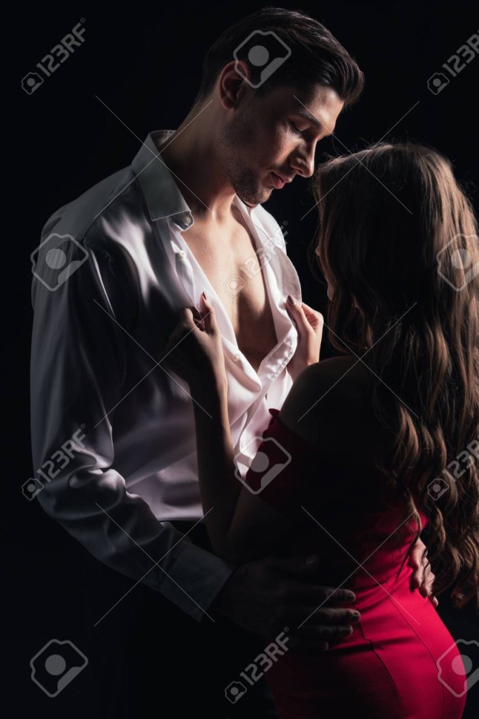 A man undresses a woman
