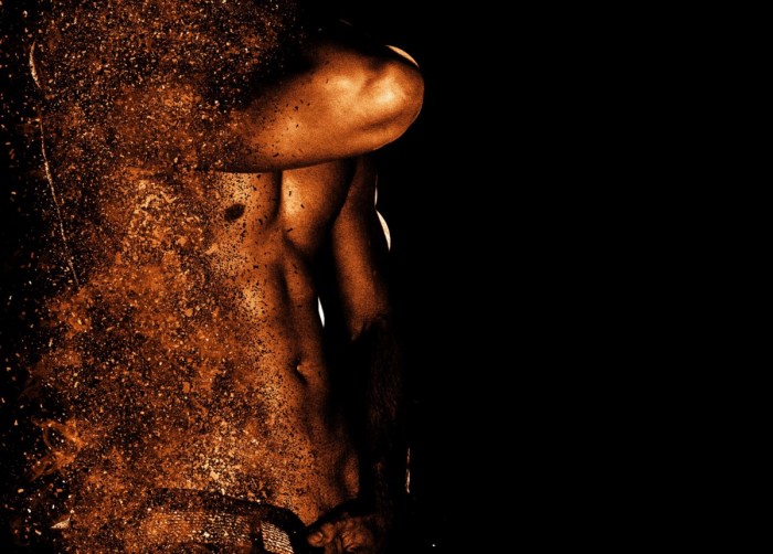 Men's body on a black background