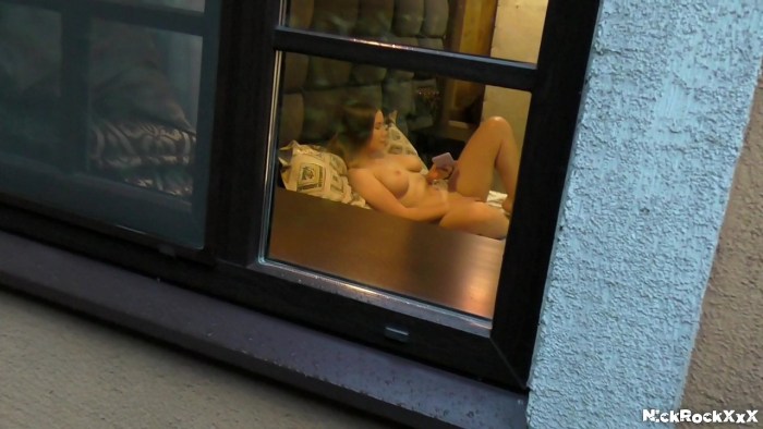 Naked on the balcony spied