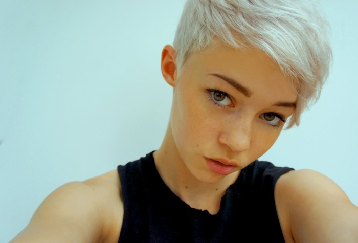 Singer with white hair and short haircut