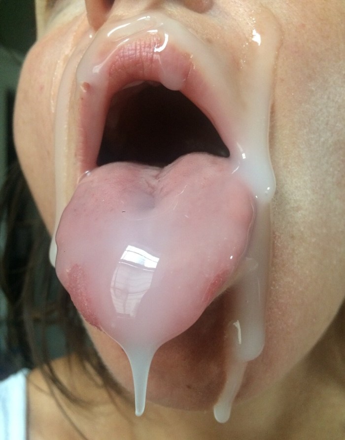 Cumshot on a close -up language sticking out