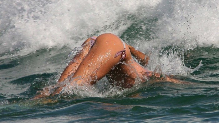 A woman dives into the sea