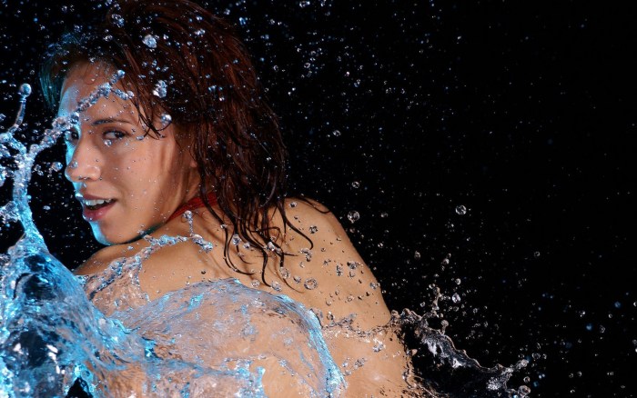 Girl in splashes of water
