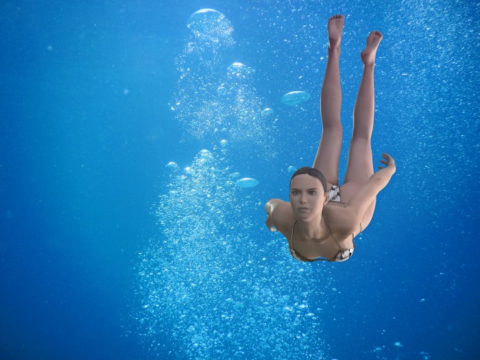 Girl jumping into the water