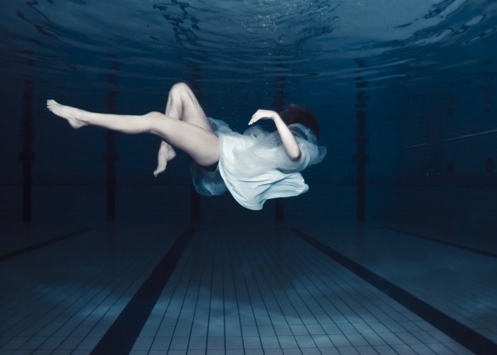 Girl sinking in water