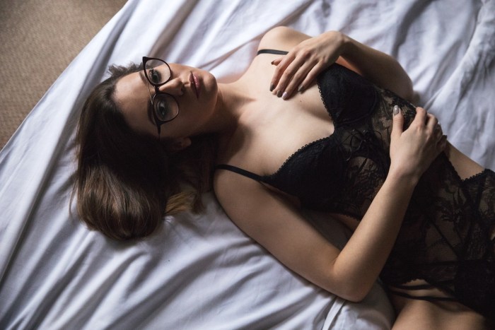 Girls with glasses in bed