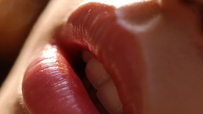 Female mouth with a tongue