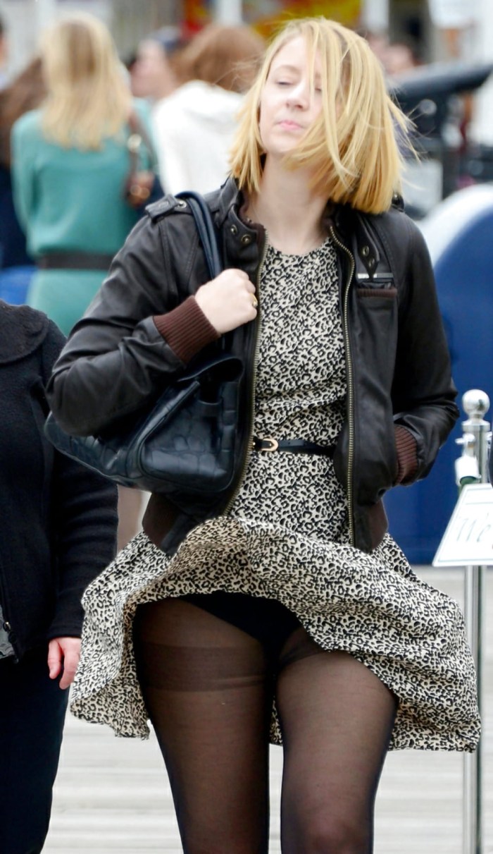 In pantyhose with a lifted skirt